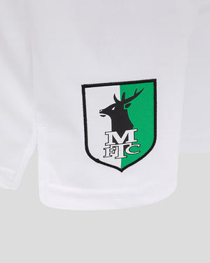 Close up of Mansfield shield crest on left leg of white shorts