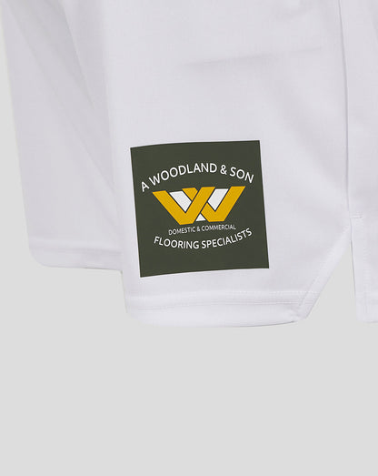 Close-up of white Mansfield Away Shorts fabric with a dark square patch at the hem