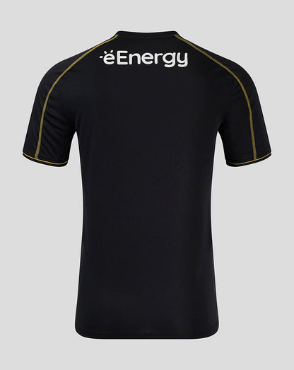 Back view of Mk Dons 24/25 third shirt in black shows eEnergy sponsor on the upper back with gold piping along the seams