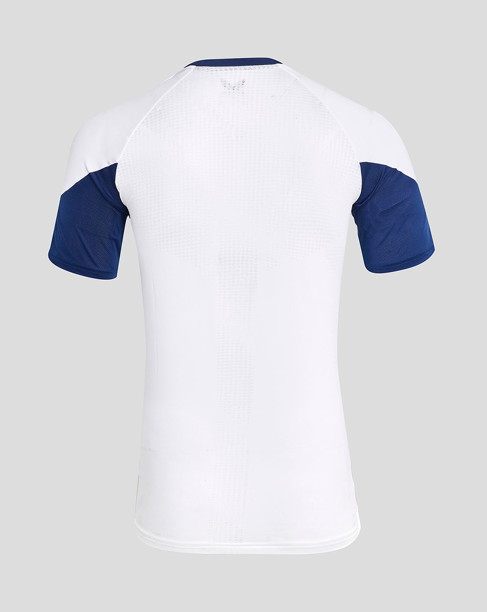 Back view of white Rangers training tee with perforated upper back and blue raglan sleeves
