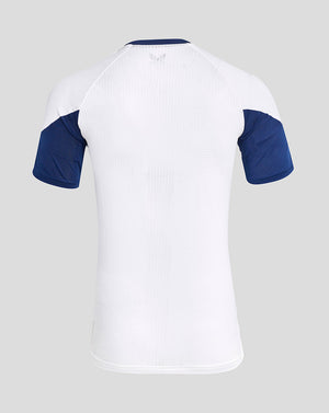 Back view of white Rangers training tee with perforated upper back and blue raglan sleeves