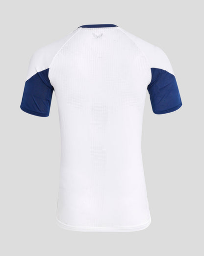 Back view of white Rangers training tee with perforated upper back and blue raglan sleeves