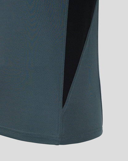 Close up of Bath Rugby training long sleeve shirt fabric in teal with a black side panel.