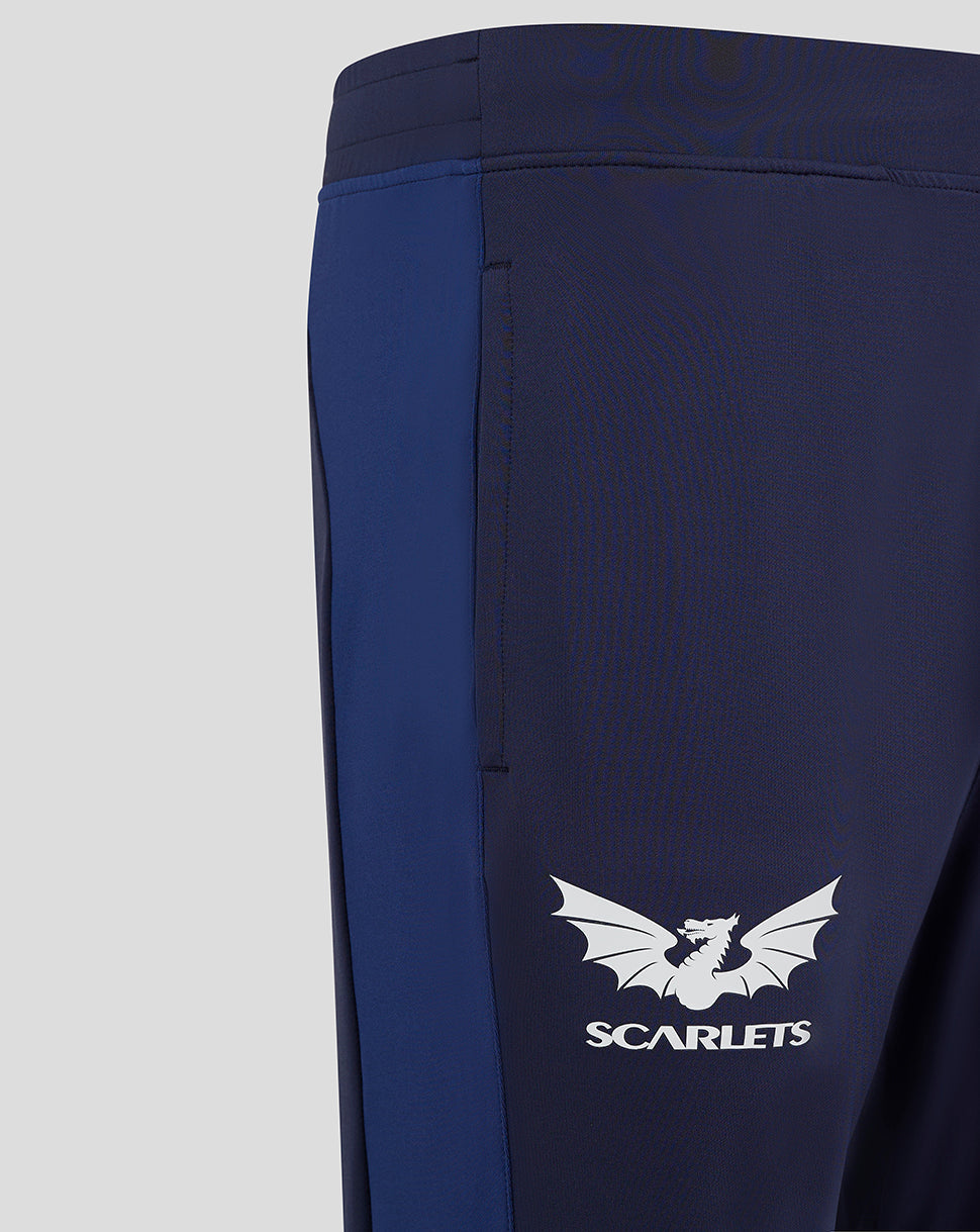Scarlets navy training pant close up showing light blue side panel and white dragon logo.