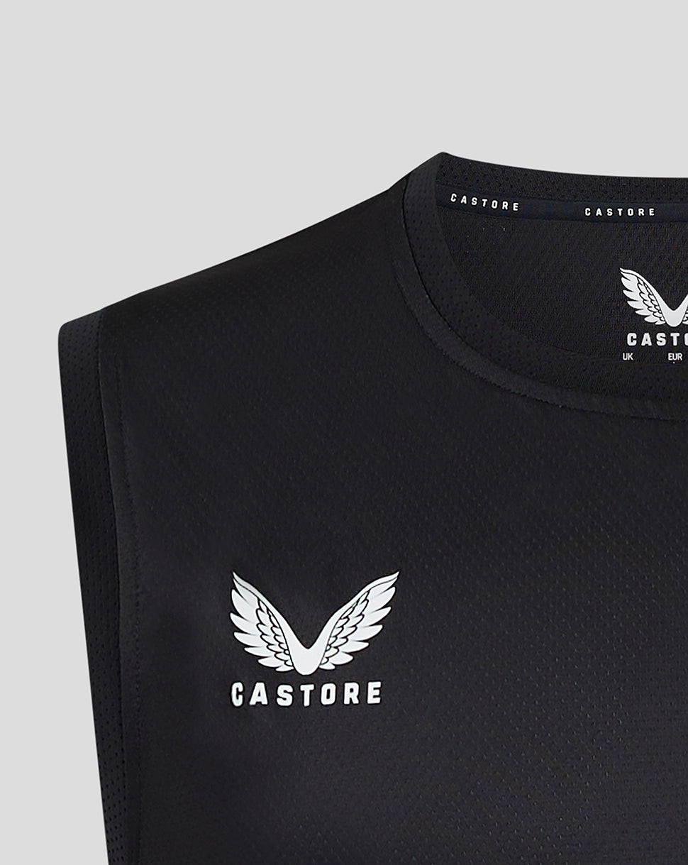 Close-up of black Saracens matchday vest with Castore logo and wing emblem.