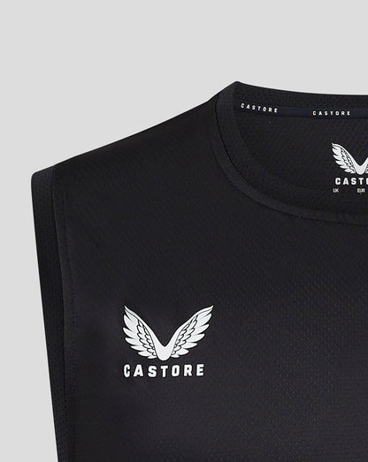 Close-up of black Saracens matchday vest with Castore logo and wing emblem.