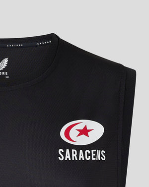 Close-up of the black vest chest showing the Saracens round logo with a red crescent and star