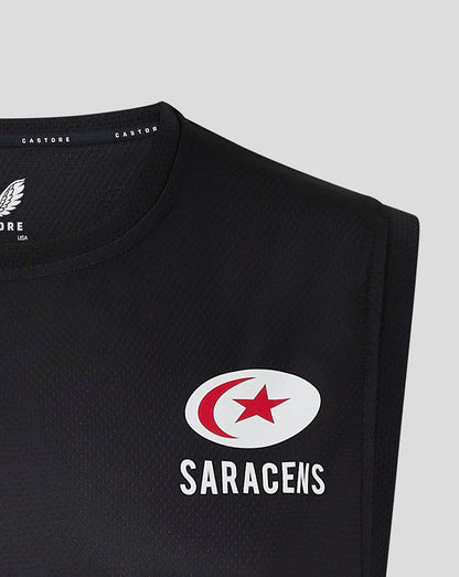Close-up of the black vest chest showing the Saracens round logo with a red crescent and star
