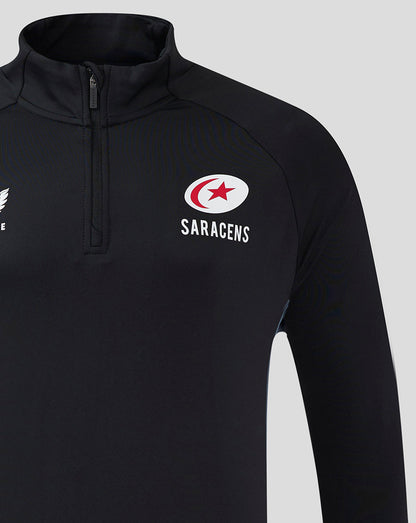 Close-up of Saracens crest on black training top