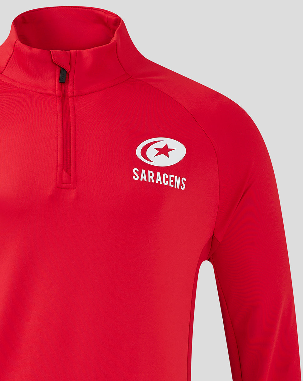 Close-up of left chest Saracens logo on red training top with quarter zip