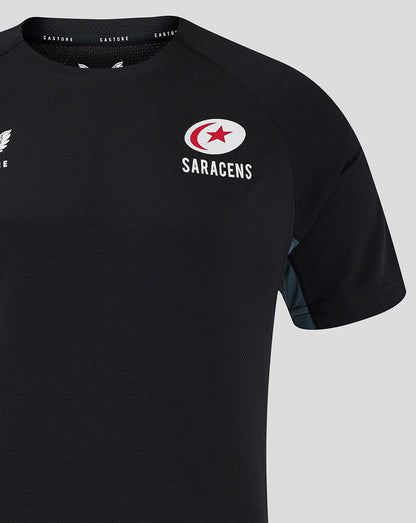 Close up of black Saracens training tee chest area showing the Saracens crest logo