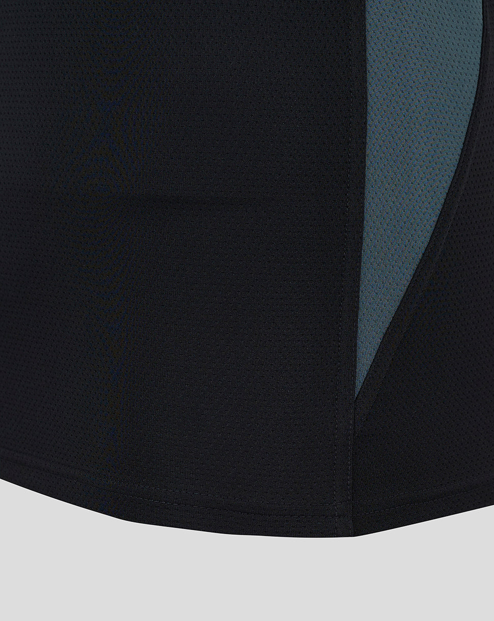Close-up of black mesh fabric with teal side panel from Saracens training vest