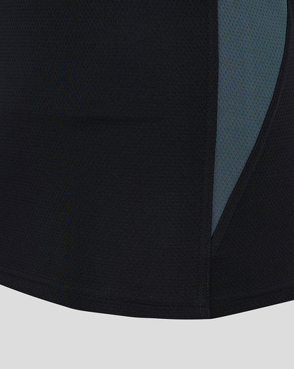 Close-up of black mesh fabric with teal side panel from Saracens training vest