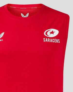 Close-up of red vest chest showing Castore logo on left and Saracens emblem on right