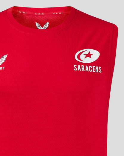 Close-up of red vest chest showing Castore logo on left and Saracens emblem on right