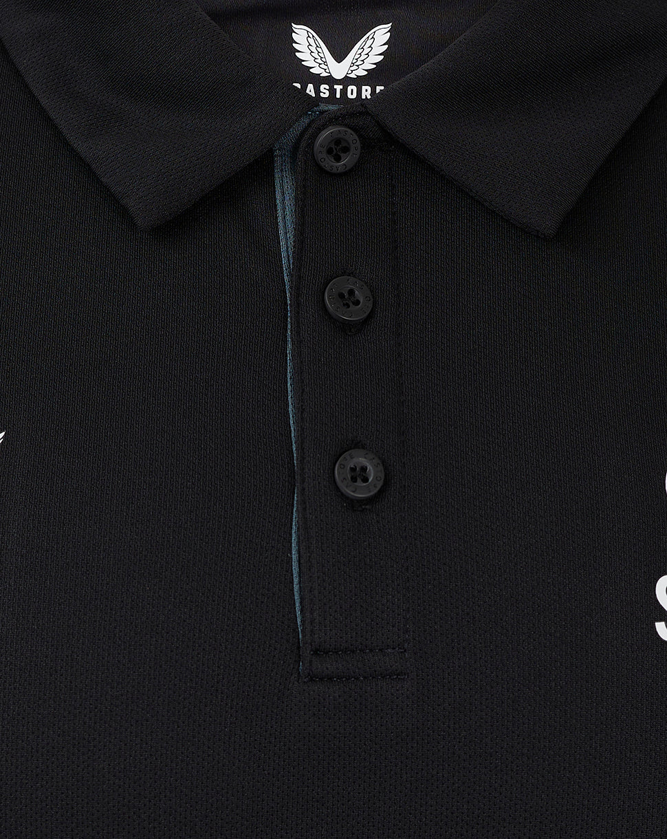 Collar and three button placket of black polo with Castore branding at the neck