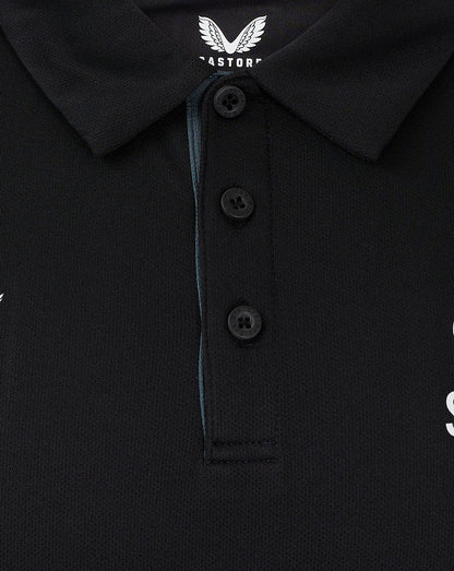 Collar and three button placket of black polo with Castore branding at the neck