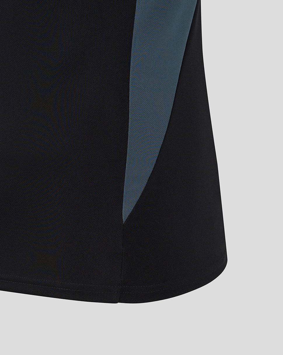 Black polo with teal side panel and curved hem