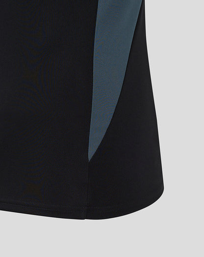 Black polo with teal side panel and curved hem