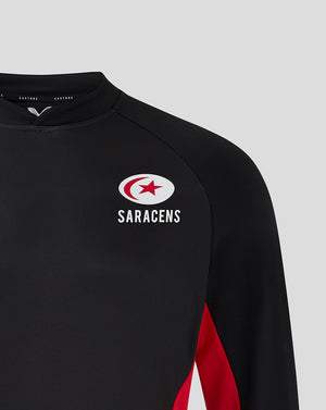 Close up of Saracens crest on the black midlayer chest