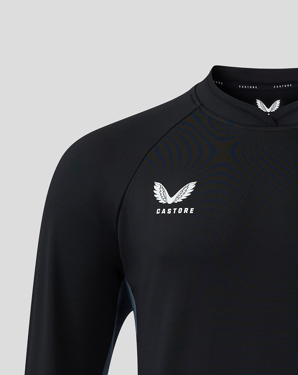 Close-up of chest displaying Castore logo with wing emblem on black training top