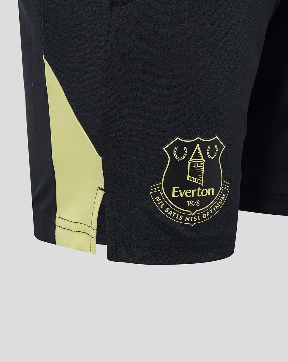 Close-up of black Everton shorts revealing gold crest badge near the hem and neon side panel