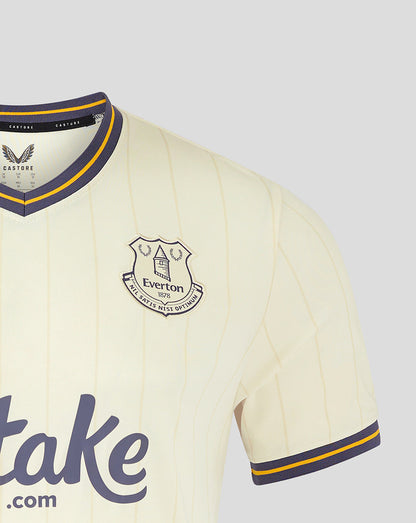 Close-up of Everton crest on cream pinstripe Third Shirt with navy and yellow collar trim.