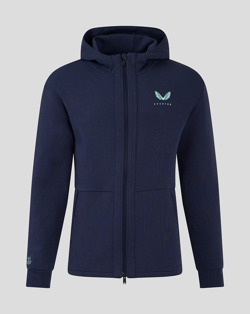 Navy blue men's hooded travel jacket with full front zipper and turquoise wing logo on the chest.
