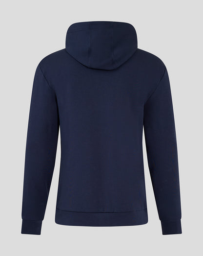 Rear view of navy blue hooded travel jacket showing an attached hood and smooth back.