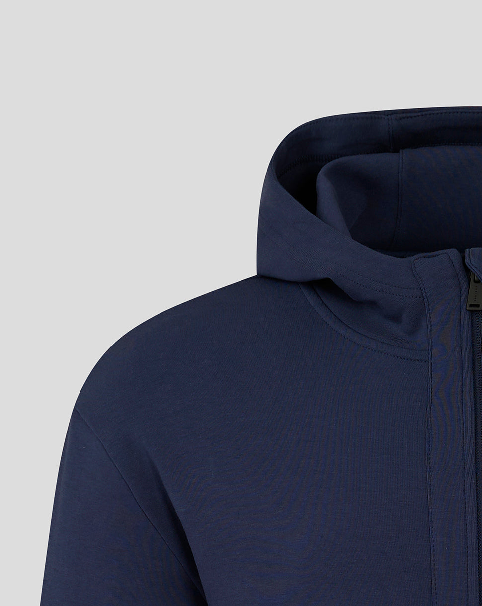 Navy hooded travel jacket close up showing the hood edge and zipper