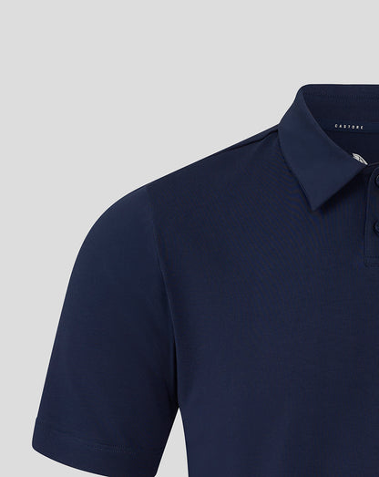 Close up of navy polo collar and shoulder seam with button placket