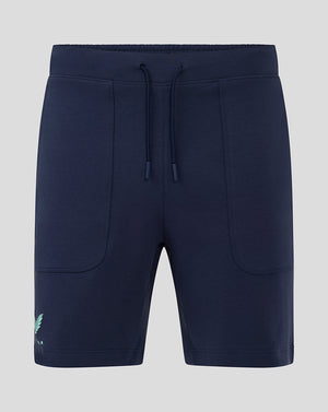 Front view of navy women's travel shorts with drawstring waist and curved patch pockets with logo at hem