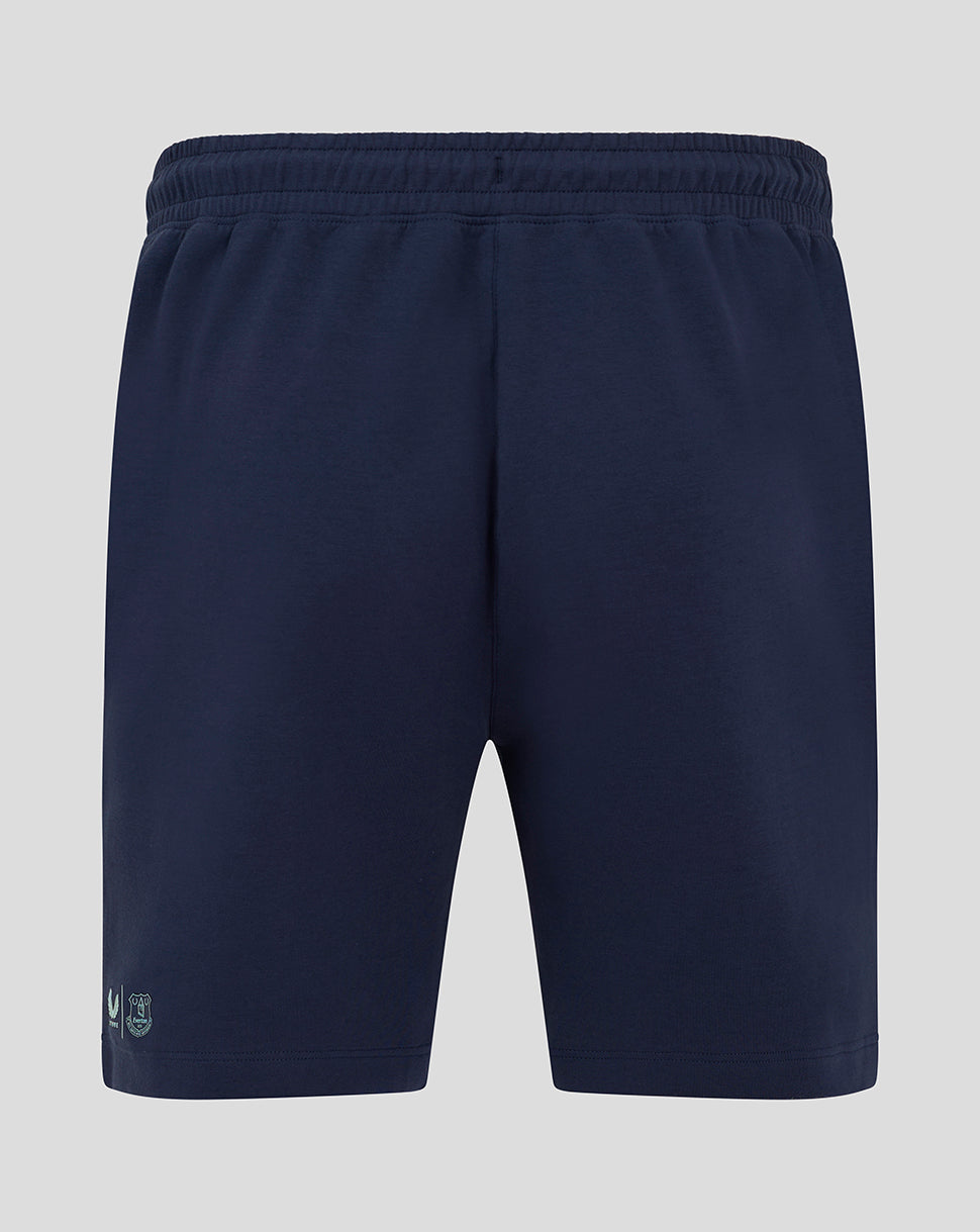 Back view of navy women's travel shorts with elastic waistband and small logo at hem