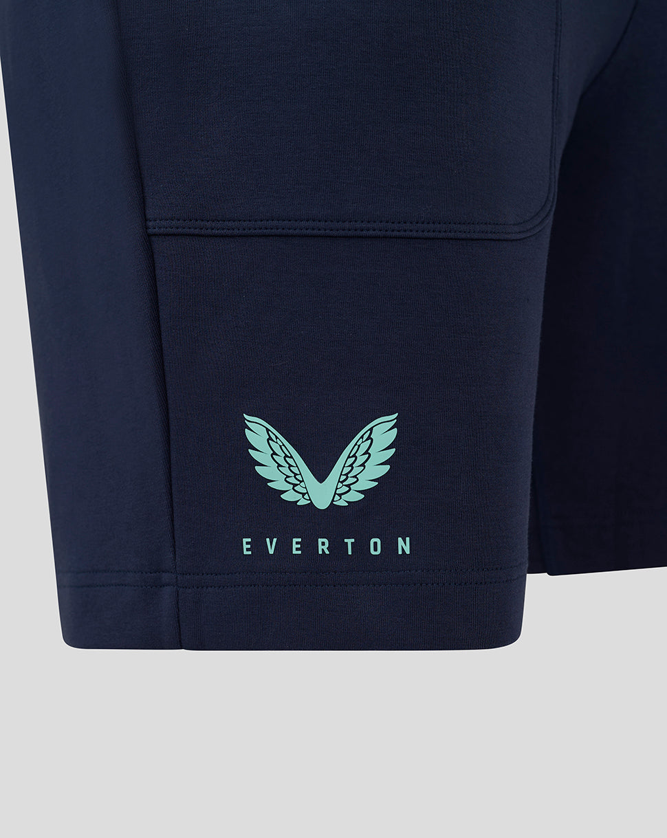 Close up of navy shorts showing mint turquoise Everton wing logo and EVERTON text
