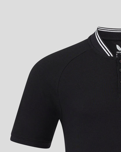 Left chest badge on black Rangers polo with white striped collar edge visible