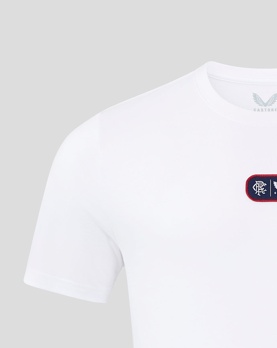 Front close up of white T shirt showing a navy rectangular chest patch with Rangers crest