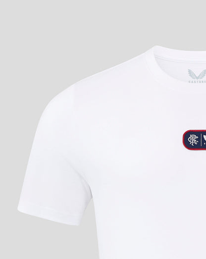 Front close up of white T shirt showing a navy rectangular chest patch with Rangers crest