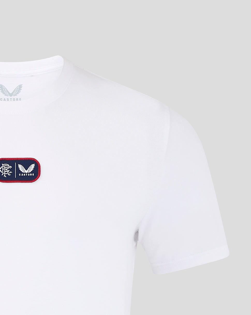 Shoulder and upper chest view of white Rangers FC T shirt with chest crest patch