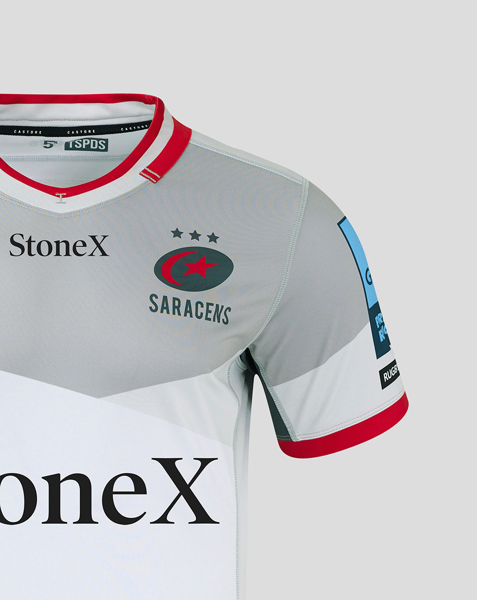 Close up of Saracens Pro Away shirt front showing StoneX logo and team crest on a grey jersey with a red collar