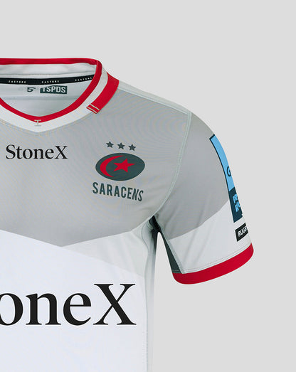 Close up of Saracens Pro Away shirt front showing StoneX logo and team crest on a grey jersey with a red collar