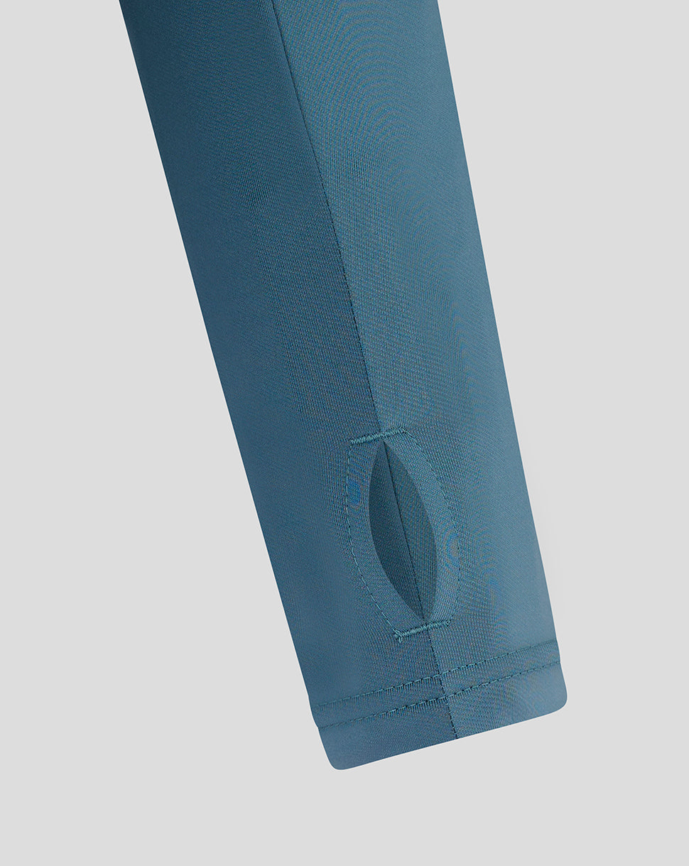 Front chest close-up on light blue Mansfield top highlighting Castore logo and crest.