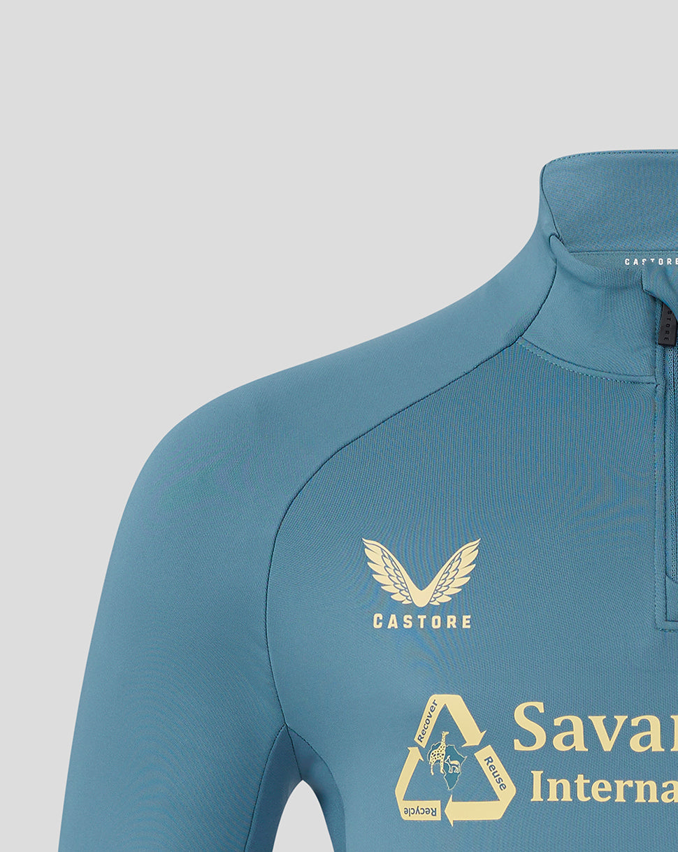 Front shoulder close-up of light blue Mansfield training top showing Castore branding.
