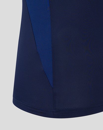 Close up of navy training tee side panel with blue color block and breathable mesh fabric texture