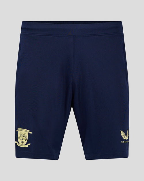 Back view of navy junior training shorts with pockets, featuring club crest on left leg and Castore logo on right leg