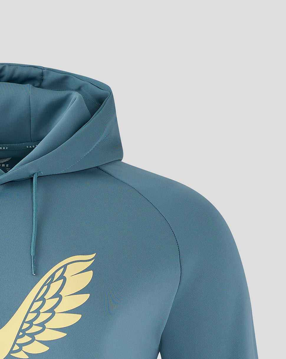 Close-up of hood and shoulder on light blue Travel Hoody with teal drawstrings and visible partial logo.