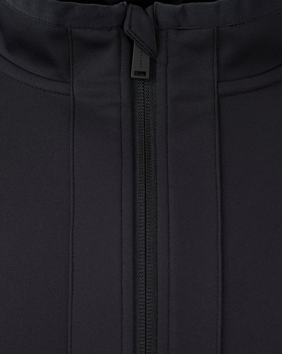 Close-up of the center front zipper and waist drawstring on the jacket