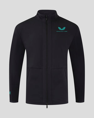 Front view of Mansfield Men's 24/25 Travel Jacket in black with teal logo on the left chest.