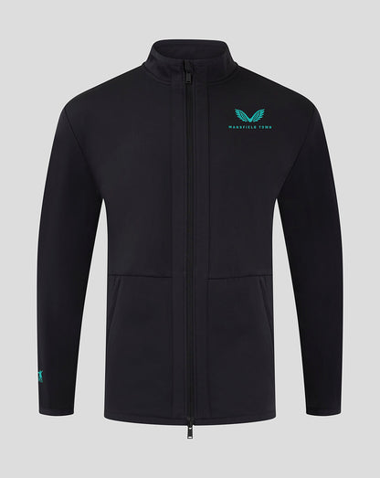 Front view of Mansfield Men's 24/25 Travel Jacket in black with teal logo on the left chest.