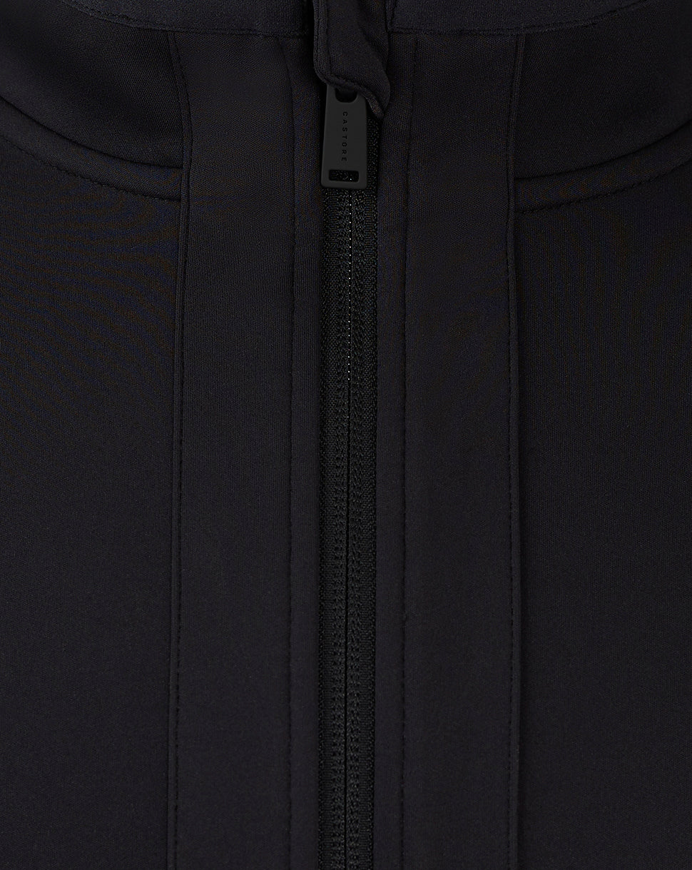 Close up of the central zipper and pull on the black Mansfield travel jacket.