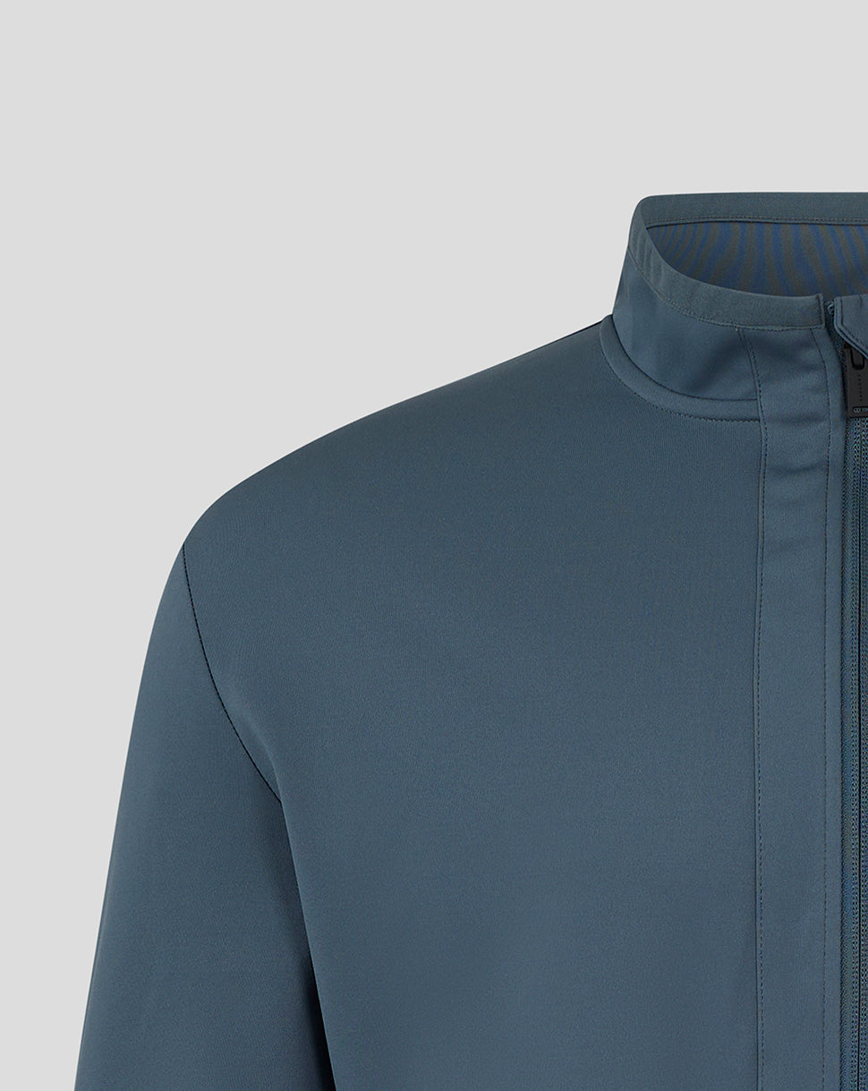 Shoulder sleeve close-up of Preston NE travel jacket with turquoise logo near cuff